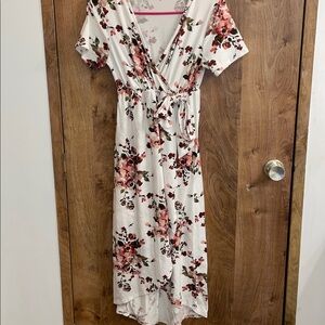Comfortable maternity high-low floral dress with a bow on the side.